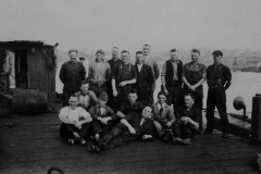 My father, back row, 6th from the right. Cigarette in one hand, cap in the other.